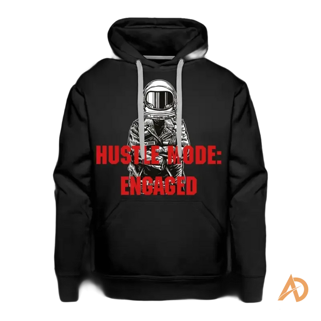 Black premium hoodie with astronaut graphic and Hustle City relentless ambition text
