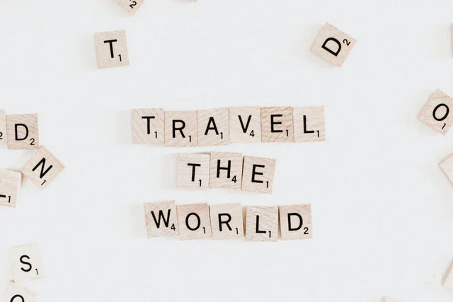 Scrabble tiles spelling Travel the World on Avodah Dynamics vision board