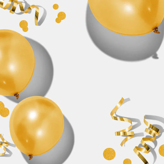 Metallic gold balloons with confetti and streamers celebrating small wins and motivation