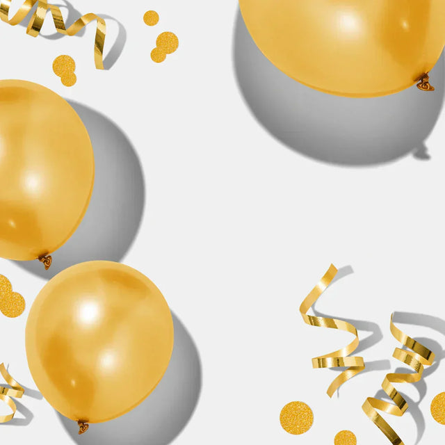 Metallic gold balloons with confetti and streamers celebrating small wins and motivation