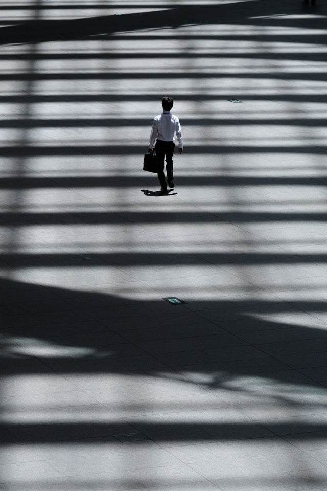 Business professional embracing change while walking in a bright space for SWOT analysis