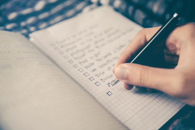 Hand writing on a checklist for purpose-driven planning to set intentions effectively