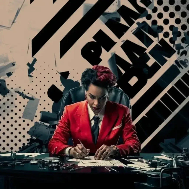 Man in a red suit demonstrating leadership skills at a desk in hustle culture context.