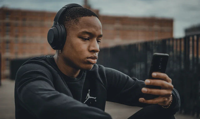 Black wireless headphones with sleek design and comfortable ear cushions for hustle culture music