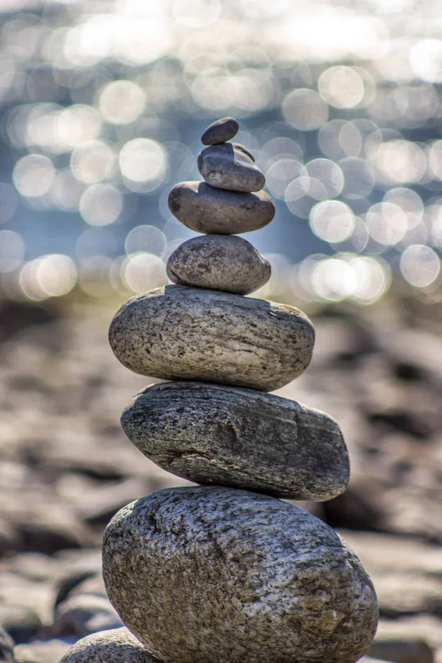 Stacked gray stones symbolizing incorporating mindfulness for effective business planning at Avodah Dynamics