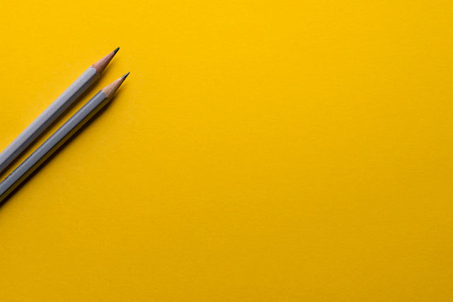 Two gray graphite pencils symbolizing inspiring parental involvement and boosting engagement in school governance
