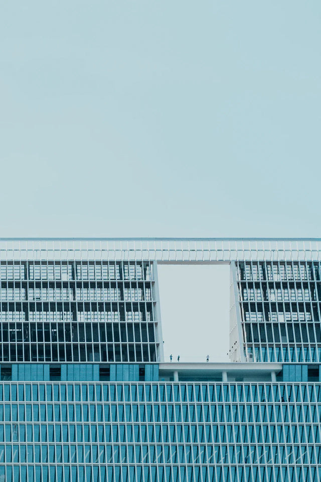 Modern building with grid facade and blank wall illustrating effective action plan concepts