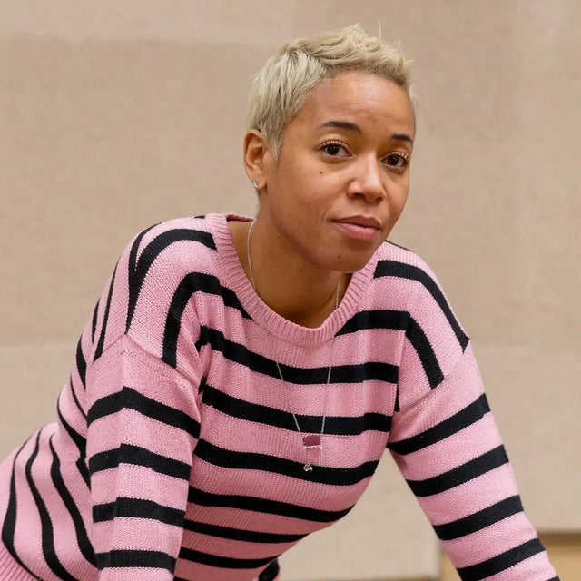 Handwritten word mindfulness on paper symbolizing incorporating mindfulness practices for workplace wellbeing.