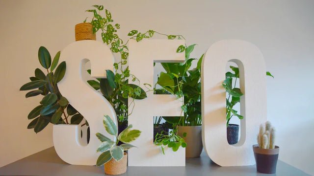 White letter planters with greenery symbolizing strong mission statement and Avodah Dynamics