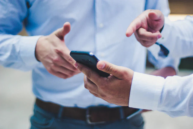 Modern smartphone being held, highlighting Avodah Dynamics and combining unique strengths