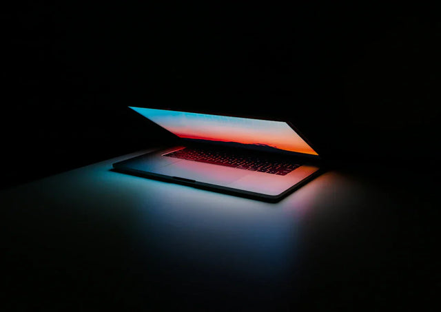 Silver laptop with colorful screen illustrating professional and personal development through mindfulness apps