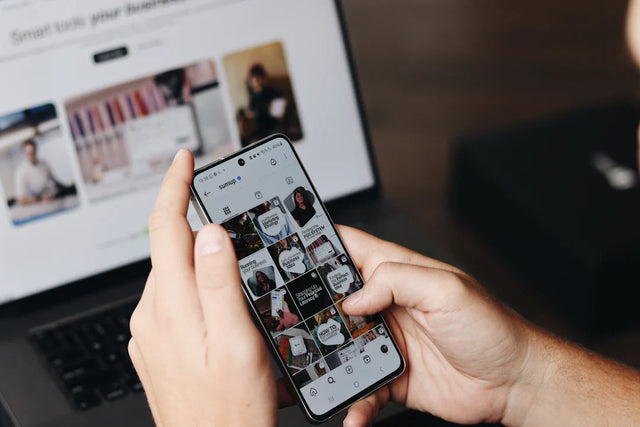 Hands holding smartphone with social media photos illustrating effective marketing strategies for driving enrollment