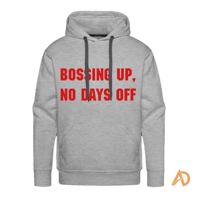 Premium hoodie in contemporary design featuring red text reading BOSSING UP, NO DAYS OFF for hustle culture