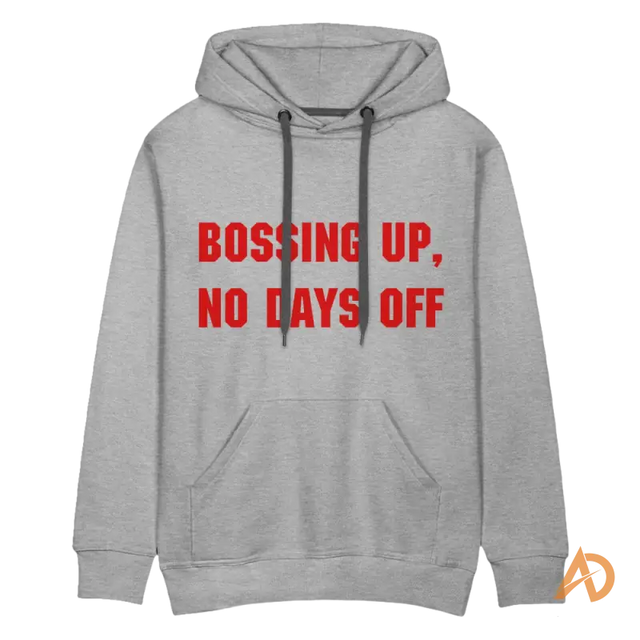 Grey premium hoodie featuring red text Bossing Up, No Days Off, embodying hustle culture