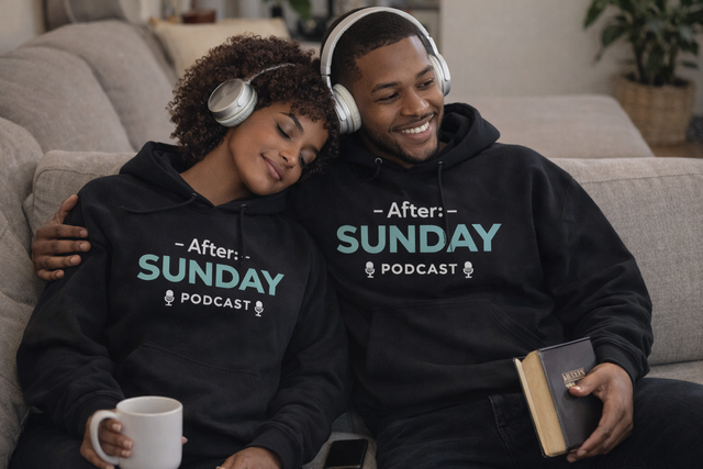 Two people wearing 'After Sunday Podcast' hoodies, sitting on a couch with one holding a mug and the other a book.