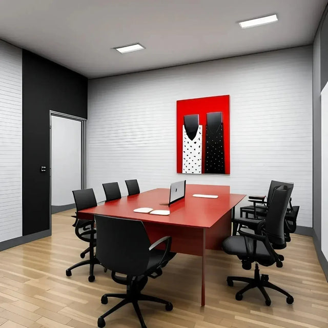 Red table and chairs in an office for maximizing productivity and work life balance.