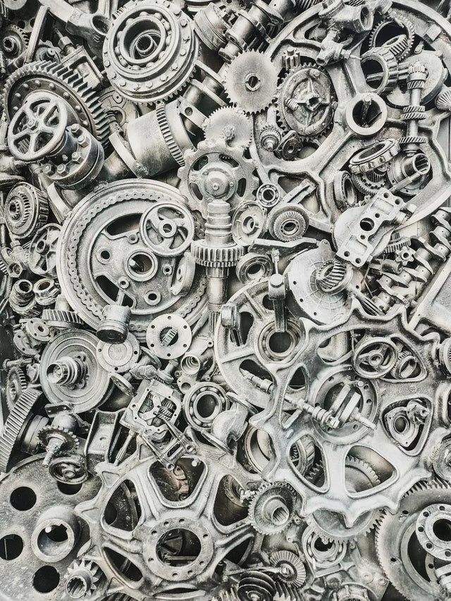 Intricate mechanical gears symbolize adaptable leaders fostering emotional intelligence in teams.