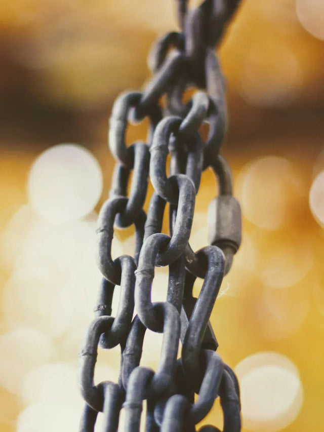 Weathered metal chain symbolizing ethical supply chain integrity