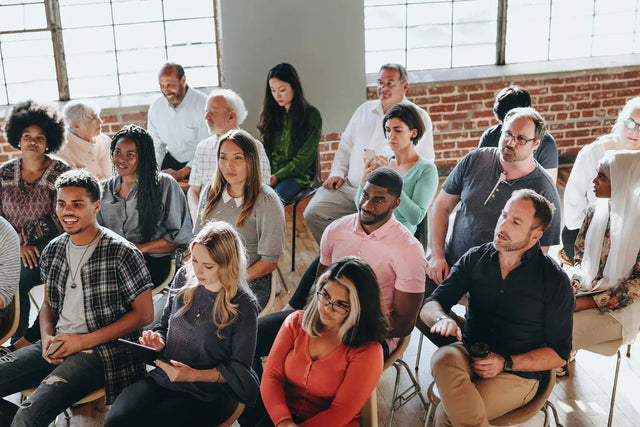 Diverse group in purpose-driven leadership meeting, everyone’s running.
