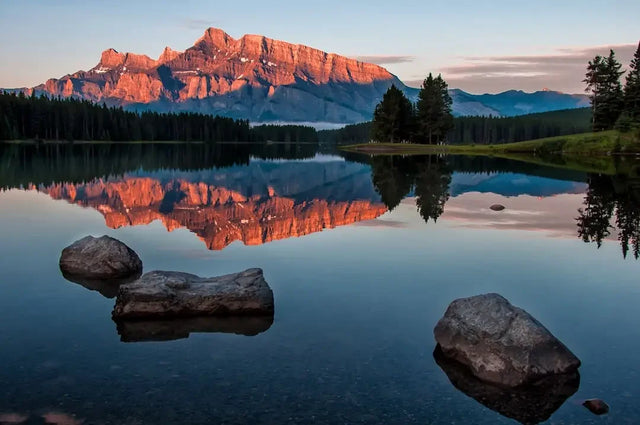 Mount Rundle sunrise reflection in Two Jack Lake, prioritizing self-care