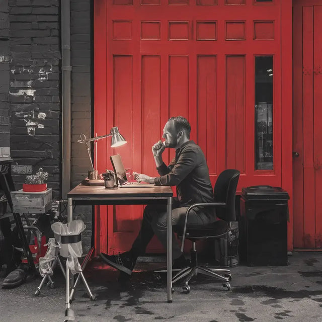 Person practicing mindfulness on mountain top for mental wellness