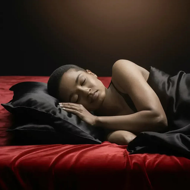 Woman resting on red bed for quality sleep in hustle culture