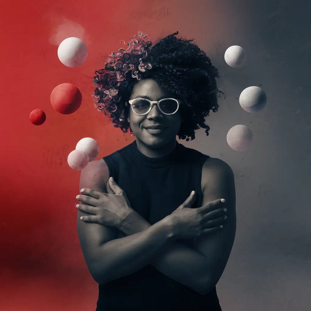 Woman with glasses holding balloons, symbolizing diversity in building strong relationships.