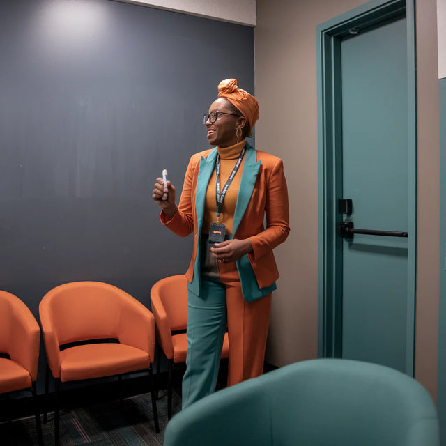 Person in vibrant orange and teal outfit representing building unshakeable resilience.