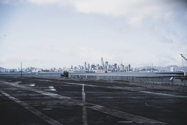 Empty concrete space with city skyline, symbolizing celebrating small wins and motivation