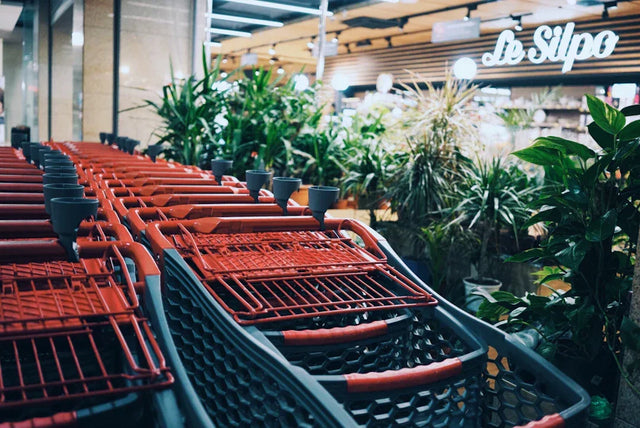 Red and black shopping carts illustrating e-commerce innovation enhancing shopping experiences