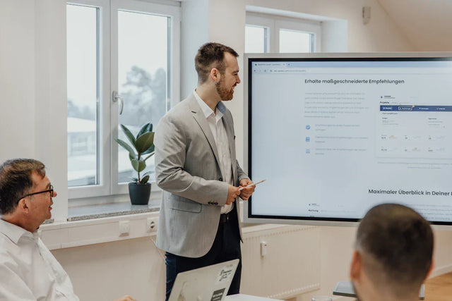 Man in blazer delivering a presentation on strategic planning in hustle culture