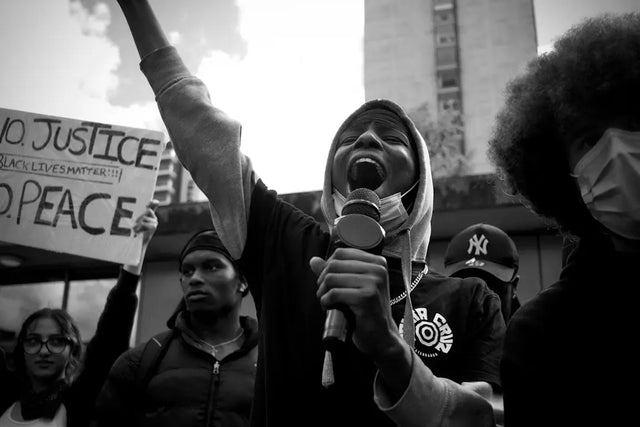 Passionate protester advocating for justice and peace at an effective conflict resolution demonstration.