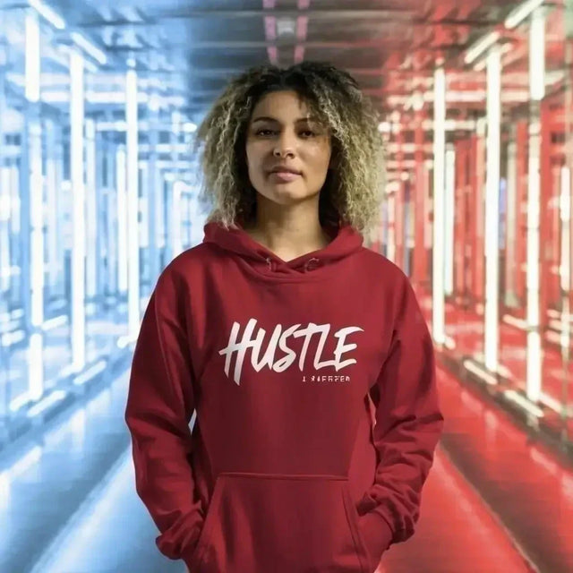 Woman in red hoodie with HT, embodying maximizing productivity in hustle culture.