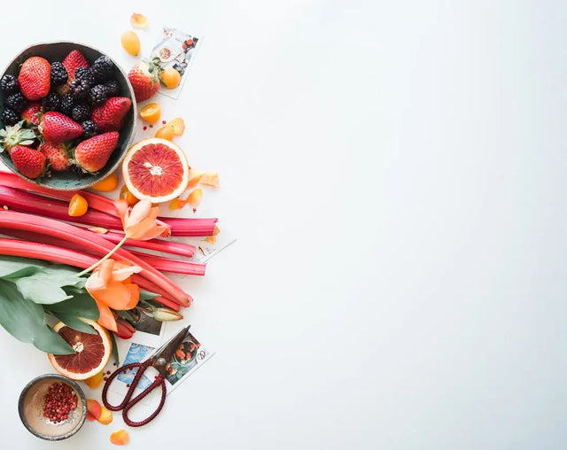 Fresh produce arrangement with rhubarb, berries, and citrus promoting healthy choices in wellbeing incentives.