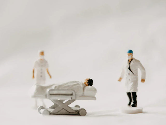Miniature medical figurines depicting small wins and trendy tote bags for everyday achievements