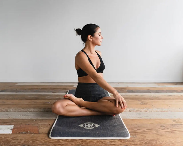 Balance board with a textured gray surface for enhancing wellness initiatives in the work environment.