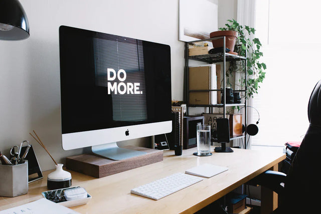Apple iMac computer with black screen symbolizing skill development for personal growth