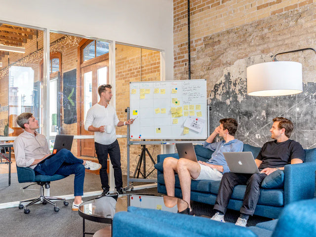 Team collaborating on a growth-oriented business plan in a modern office space