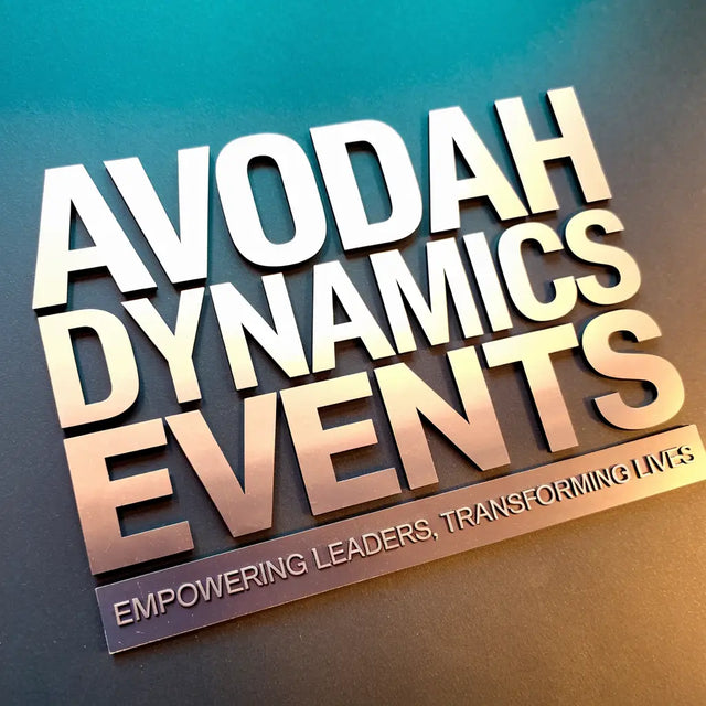 Bold 3D text reading ’AVODAH DYNAMICS EVENTS’ with ’EMPOWERING LEADERS, TRANSFORMING LIVES’ as a subtitle.