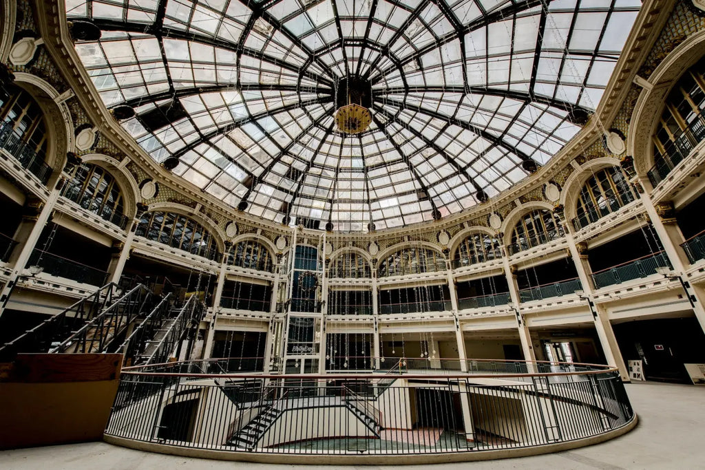 Ornate glass-domed rotunda showcasing Victorian details, embodying Dayton’s business innovation.