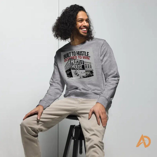 Smiling individual in Avodah Dynamics sweatshirt with set-in sleeves on a stool