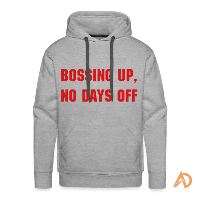 Premium hoodie in contemporary design featuring red text reading BOSSING UP, NO DAYS OFF for hustle culture