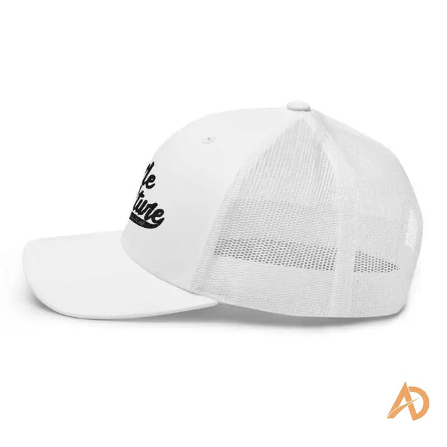 White Classic Hustle Culture Trucker Cap featuring a striking black logo