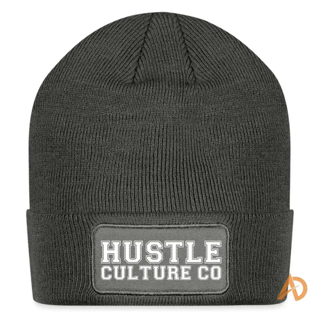 Classic Varsity Hustle Culture Patch Beanie featuring a black hat with the word hut