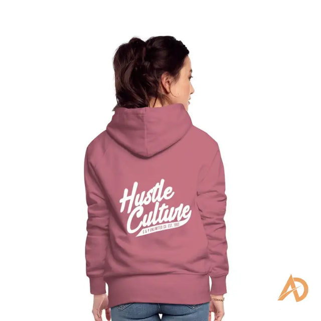 Woman in a pink Empowerment Hoodie by Hustle Culture showcasing an exclusive offering