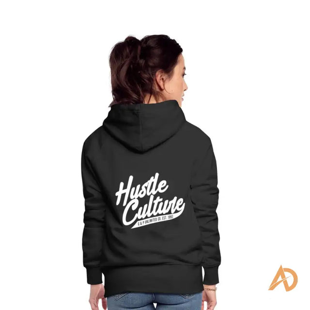 A woman in a black Empowerment Hoodie by Hustle Culture showcasing an exclusive offering