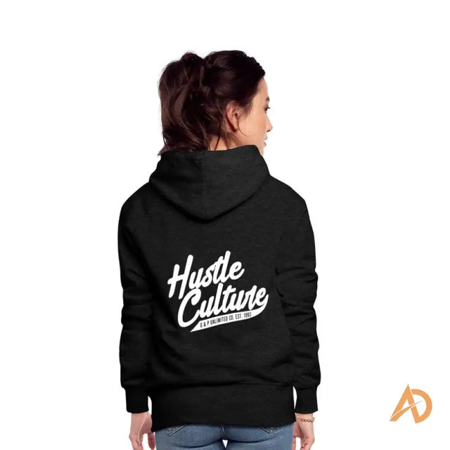 Woman in Empowerment Hoodie by Hustle Culture featuring the word hut in stylish design