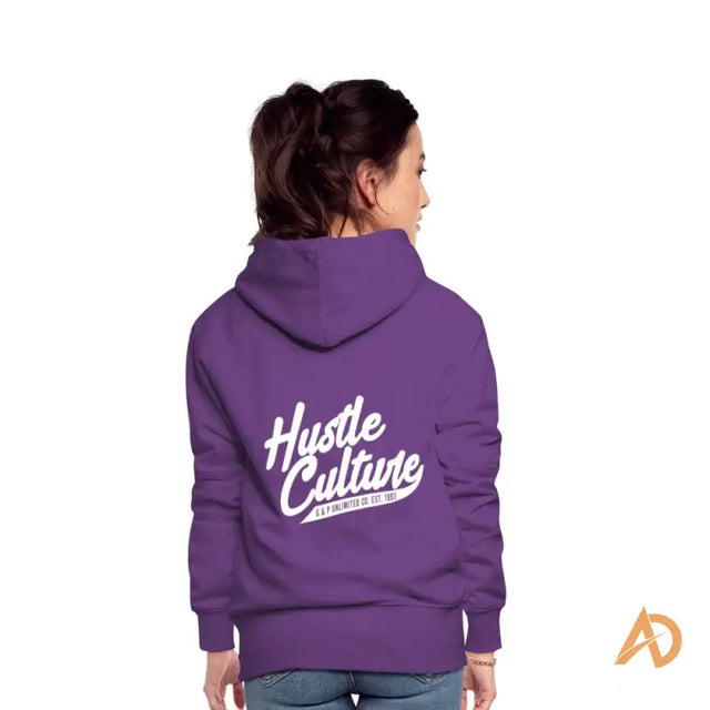 Woman in Empowerment Hoodie By Hustle Culture featuring purple design with hut text