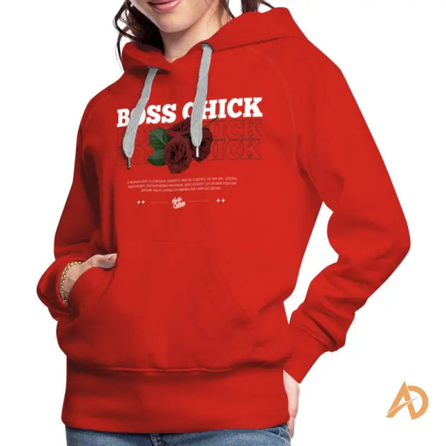 Woman in red Empowerment Hoodie by Hustle Culture featuring BSS Kick design