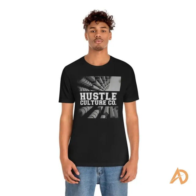 Man in black Hustle Culture streetwear tee by Andreas Sturmfels